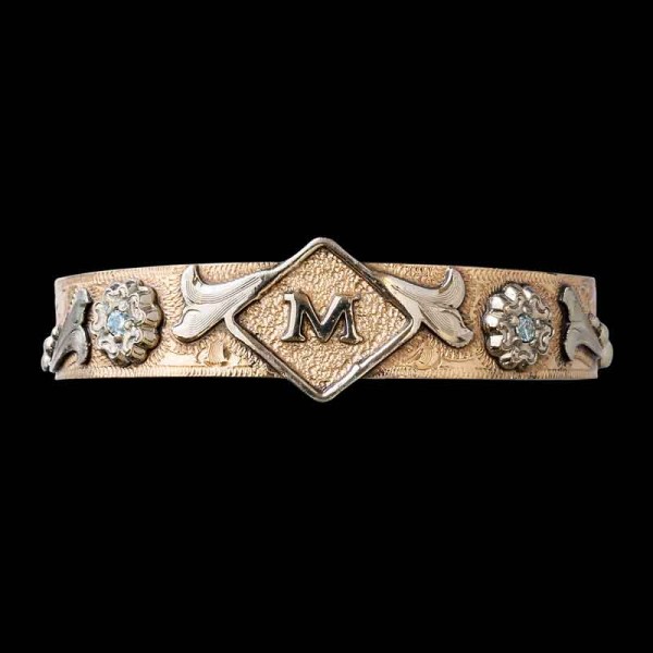 Celebrate your loved ones with the golden Wynonna Western Cuff Bracelet, featuring a matted Jeweler's Bronze base with silver details and customizable stones. Order it now!